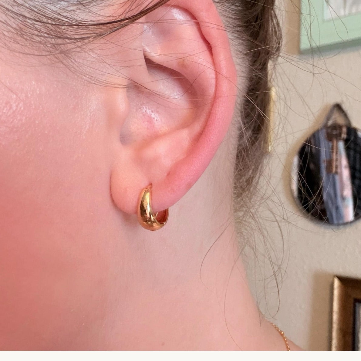 Customer wearing Belle Oro gold hoops